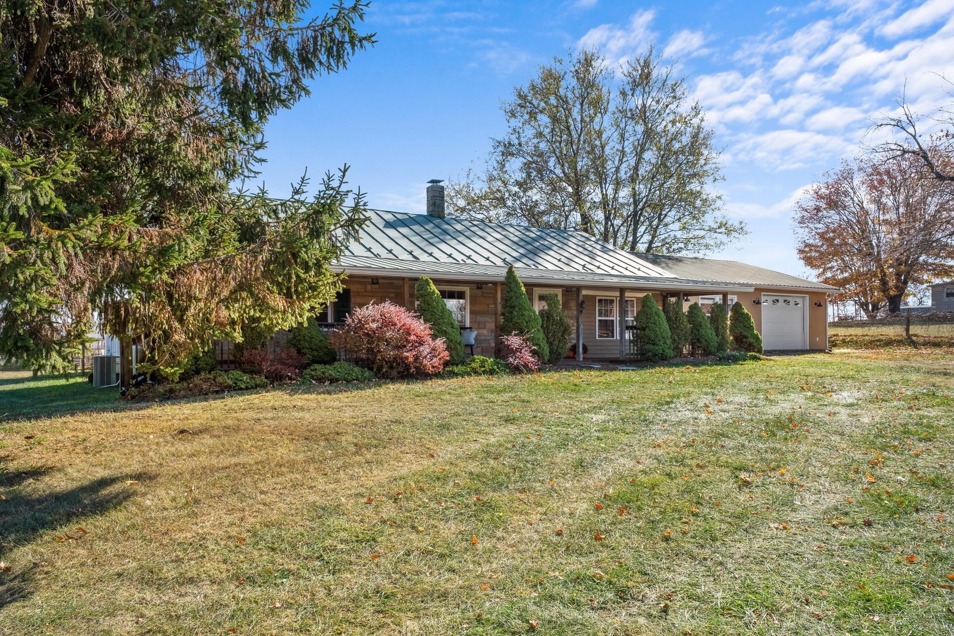 1426 Middlebrook Road Staunton, VA 24401 - Photo 3 of 45 a front view of a house with a garden