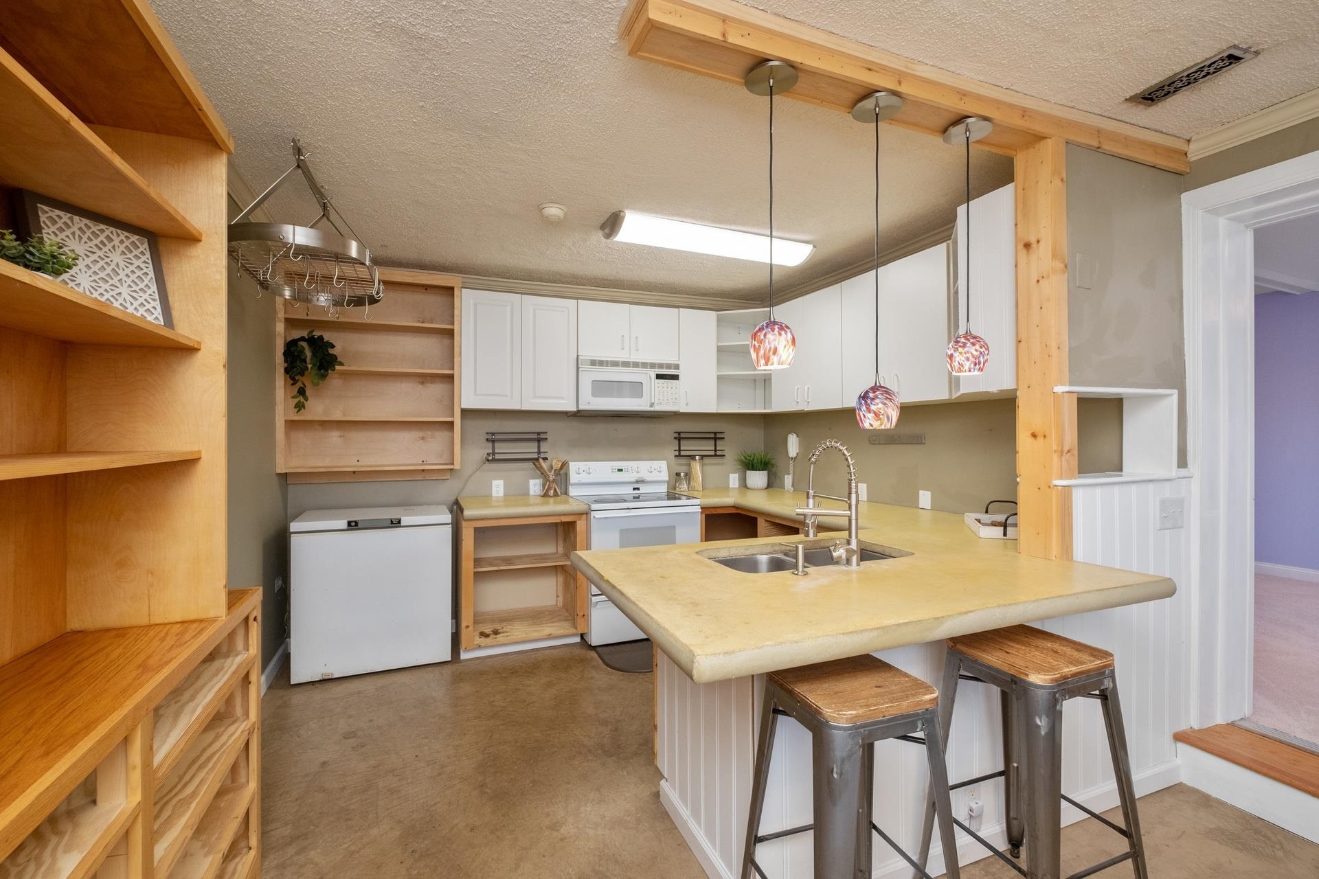 1426 Middlebrook Road Staunton, VA 24401 - Photo 7 of 45 a kitchen with a sink a stove a refrigerator and chairs