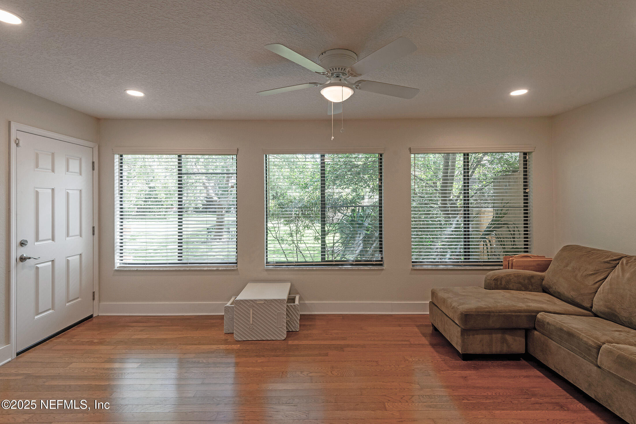 346 Raleigh Road, Unit 346 Jacksonville, FL 32225 - Photo 20 of 43 a living room with furniture and a large window
