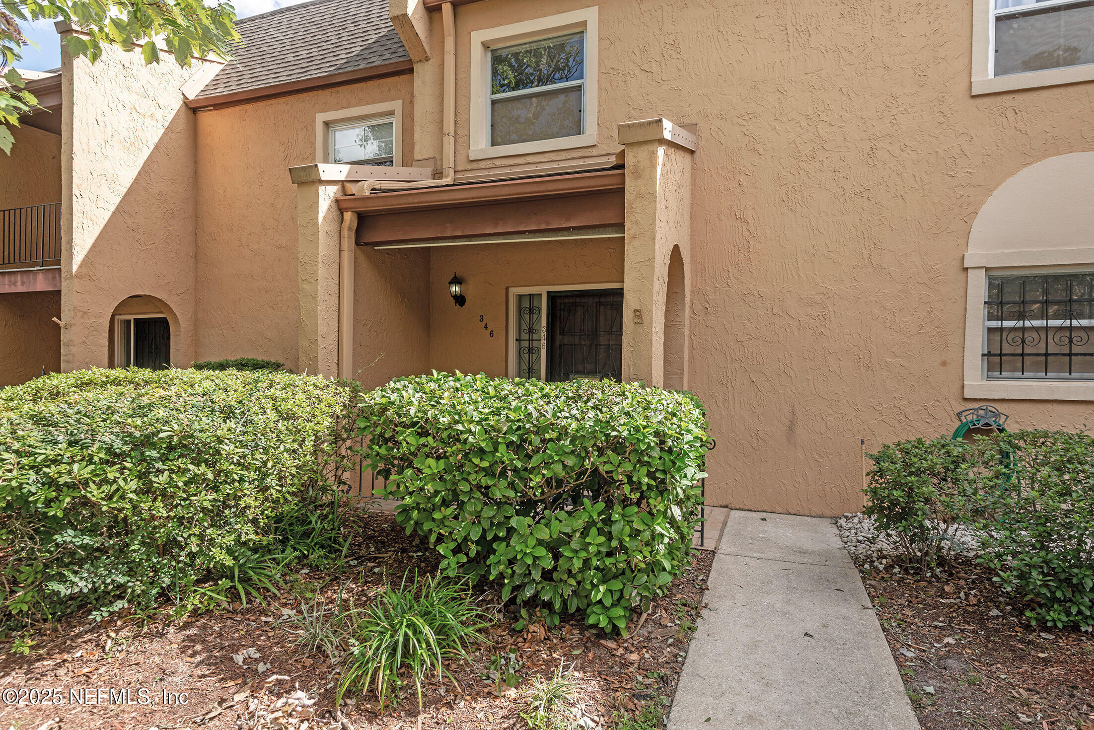 346 Raleigh Road, Unit 346 Jacksonville, FL 32225 - Photo 2 of 43 a view of a house with a garden