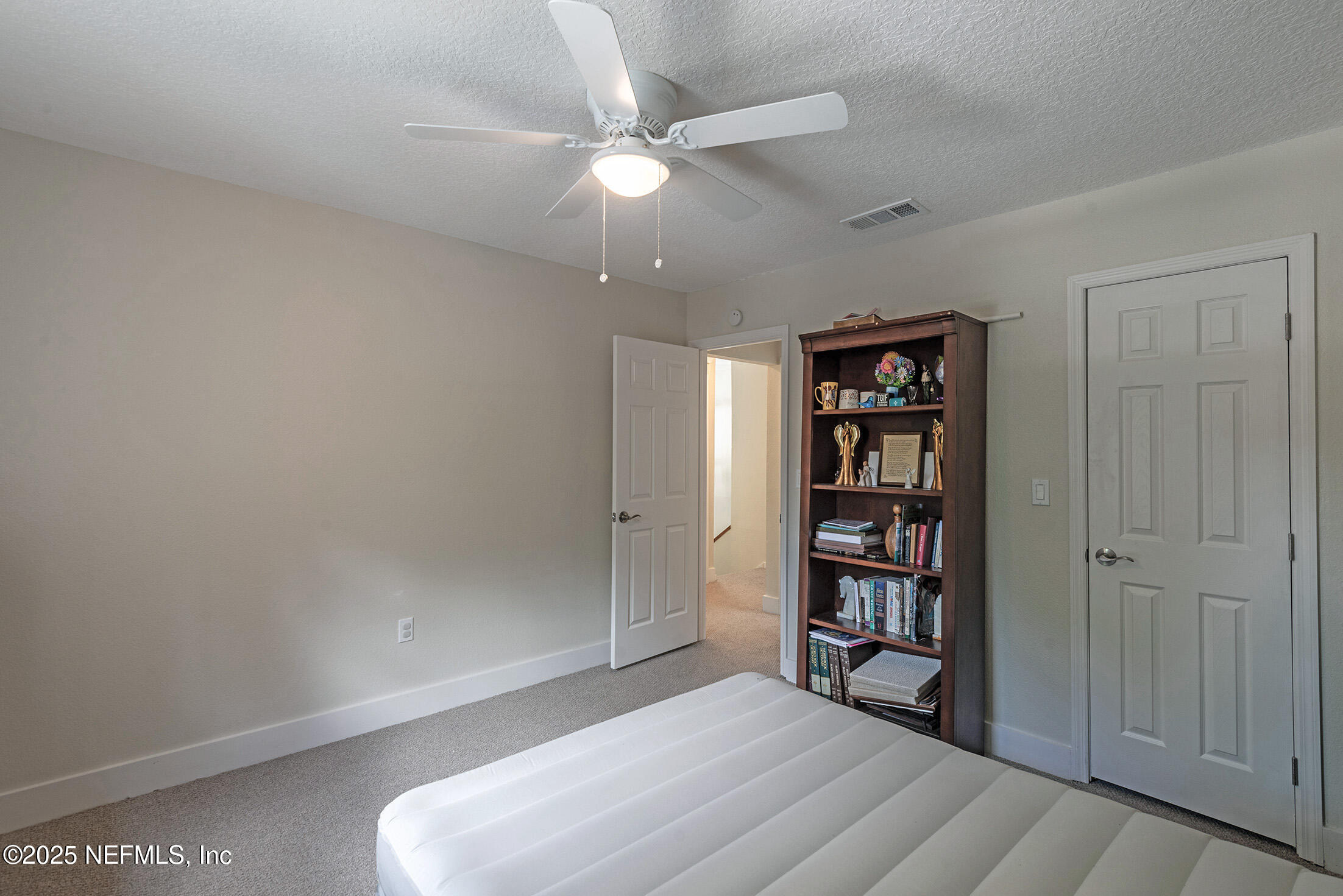 346 Raleigh Road, Unit 346 Jacksonville, FL 32225 - Photo 34 of 43 an empty room with shelves