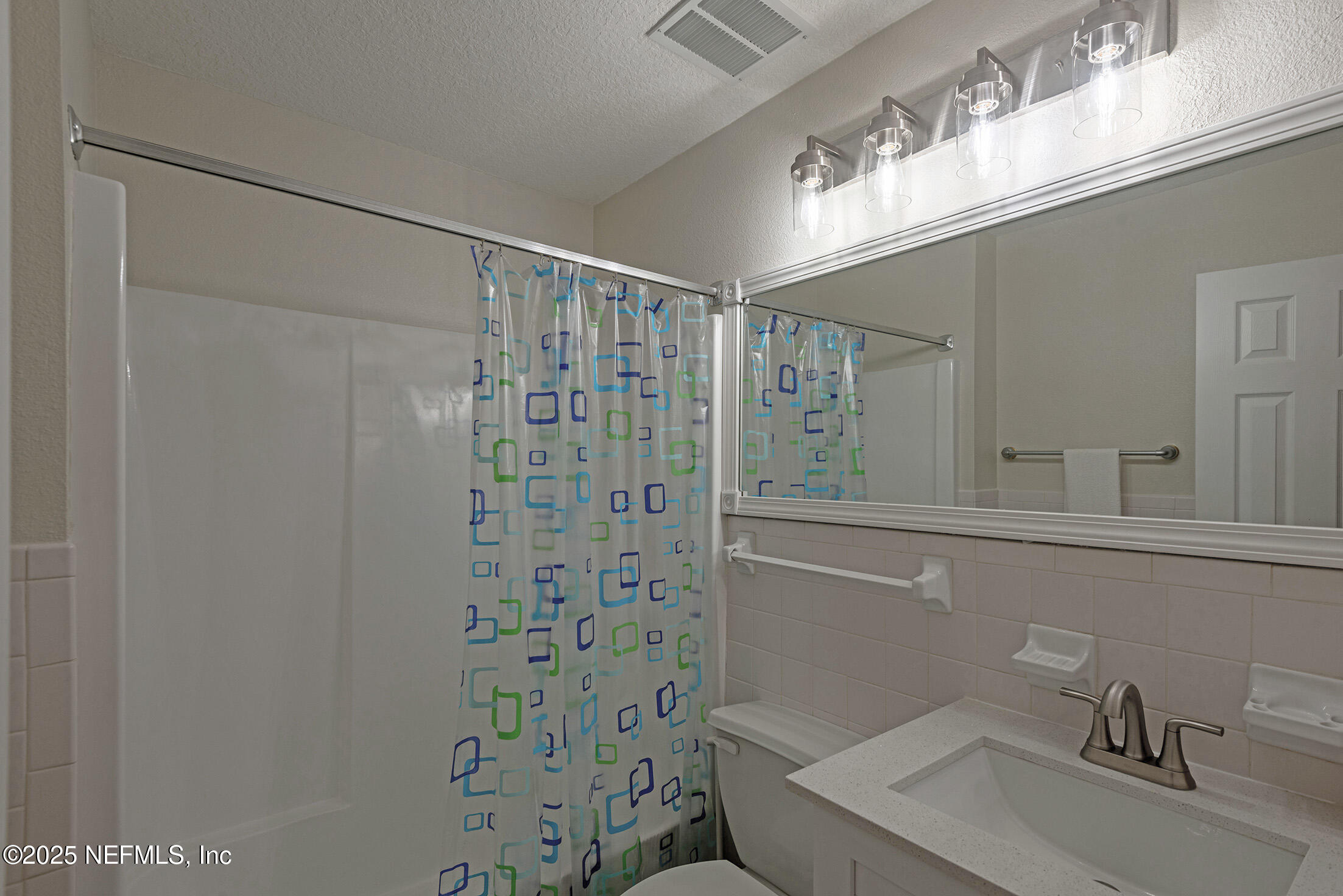 346 Raleigh Road, Unit 346 Jacksonville, FL 32225 - Photo 35 of 43 a bathroom with a sink a toilet and shower