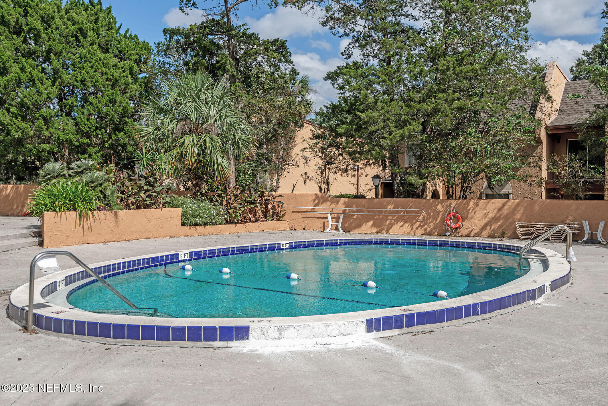 346 Raleigh Road, Unit 346 Jacksonville, FL 32225 - Photo 40 of 43 a view of a swimming pool with a yard
