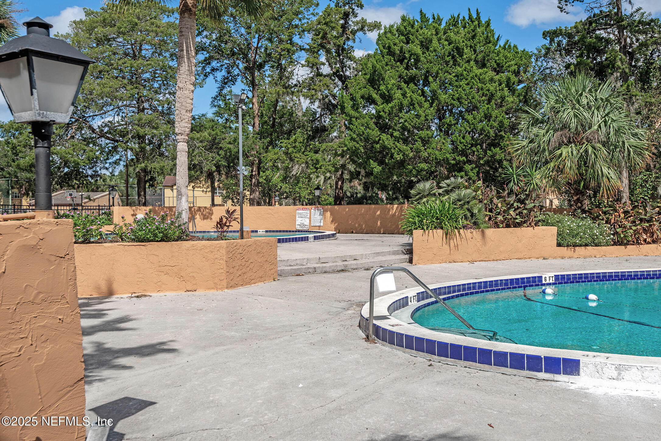 346 Raleigh Road, Unit 346 Jacksonville, FL 32225 - Photo 43 of 43 a view of a swimming pool with a patio