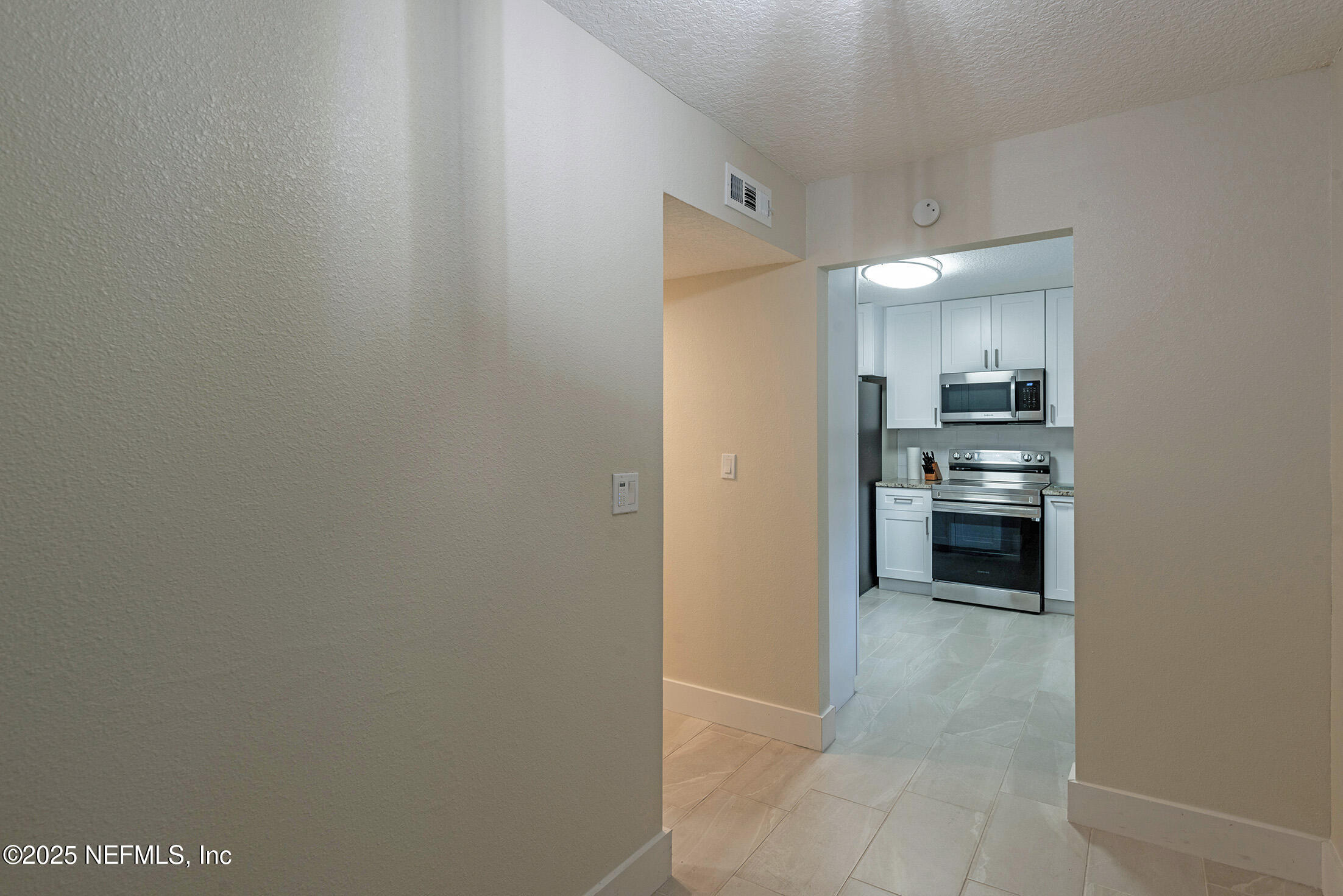 346 Raleigh Road, Unit 346 Jacksonville, FL 32225 - Photo 6 of 43 a view of a kitchen with a sink and dishwasher stove top oven