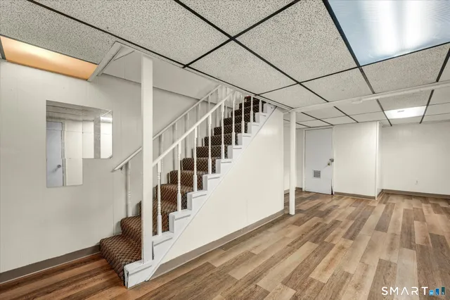 a view of an entryway with wooden floor