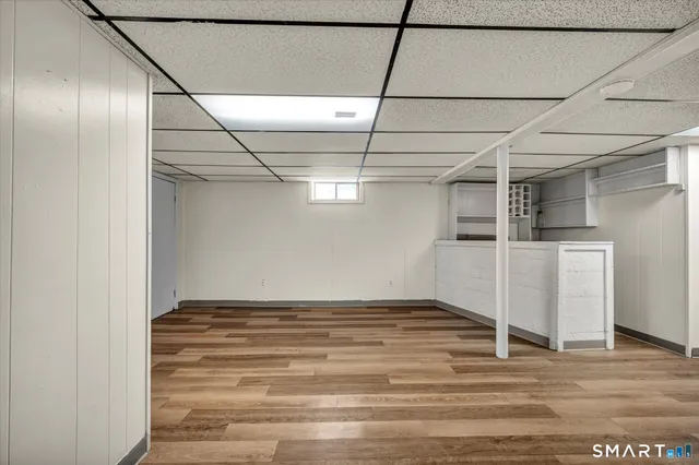 a view of a room with wooden floor