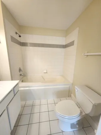 a bathroom with a toilet a sink and bathtub