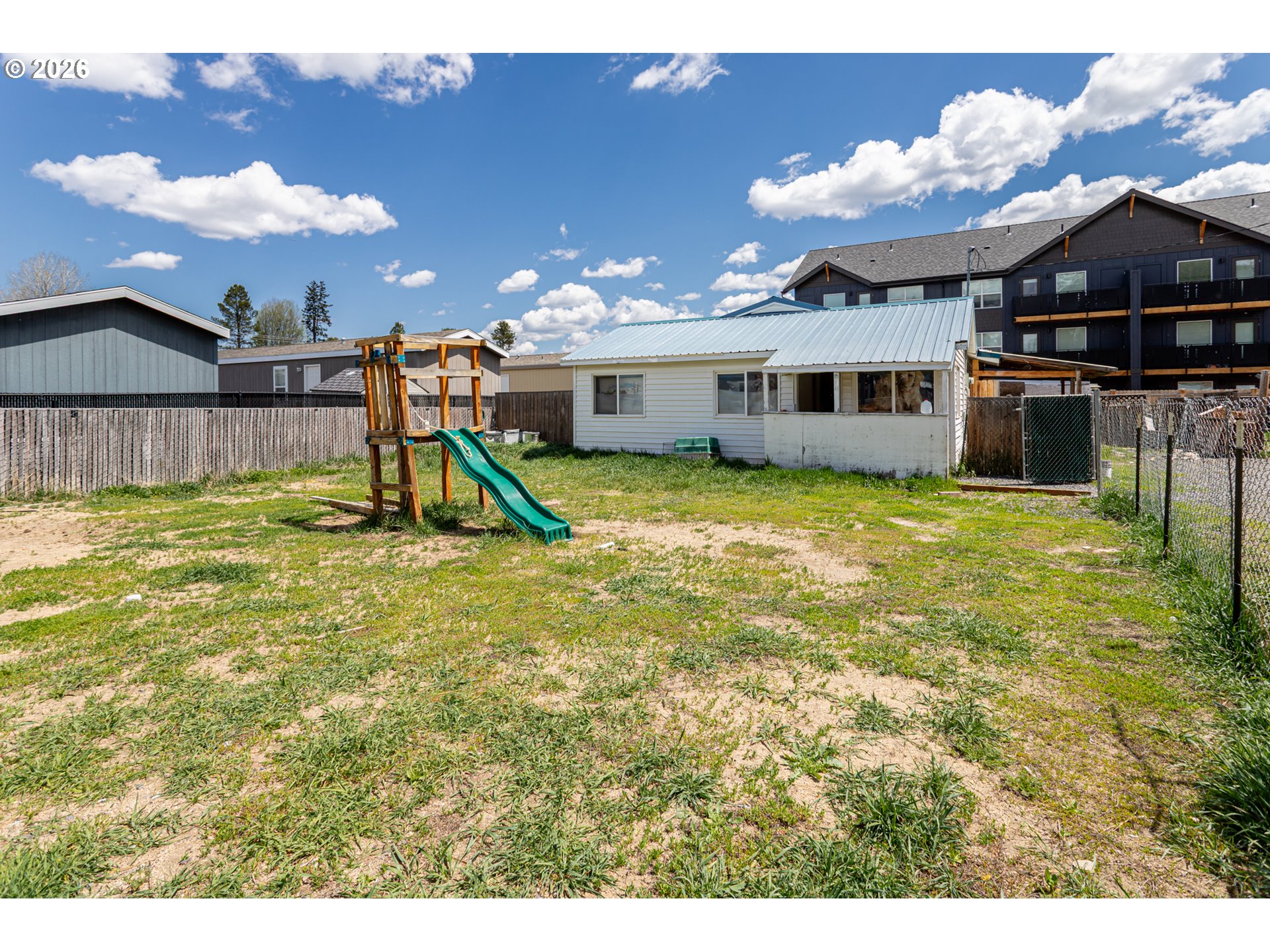 51380 Preble Way La Pine, OR 97739 - Photo 20 of 26 a view of a house with a swimming pool and a yard