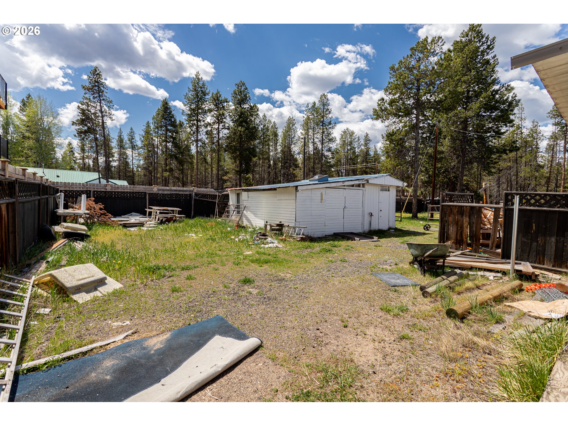 51380 Preble Way La Pine, OR 97739 - Photo 22 of 26 a view of a swimming pool with a yard