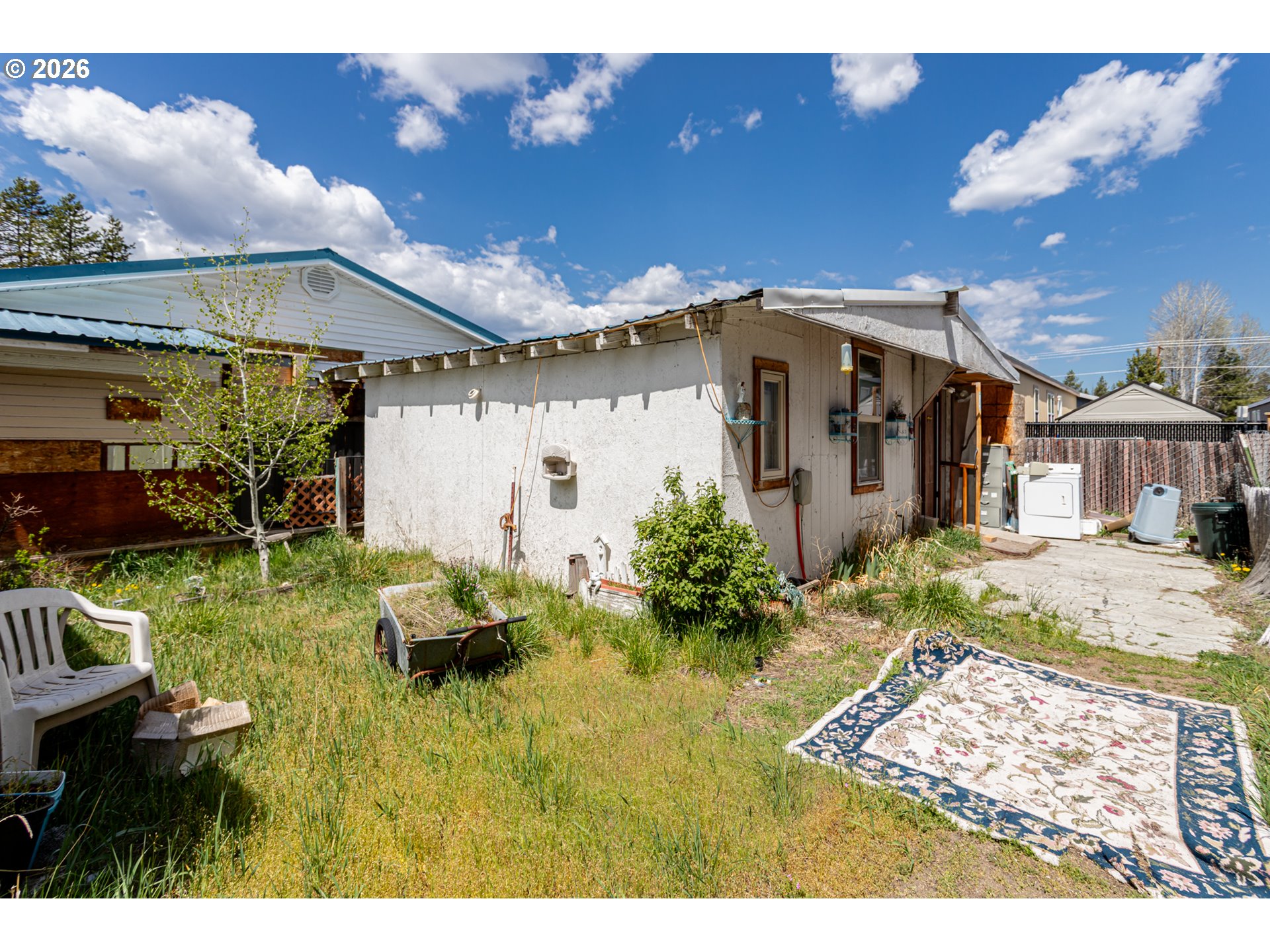 51380 Preble Way La Pine, OR 97739 - Photo 24 of 26 a front view of a house with garden