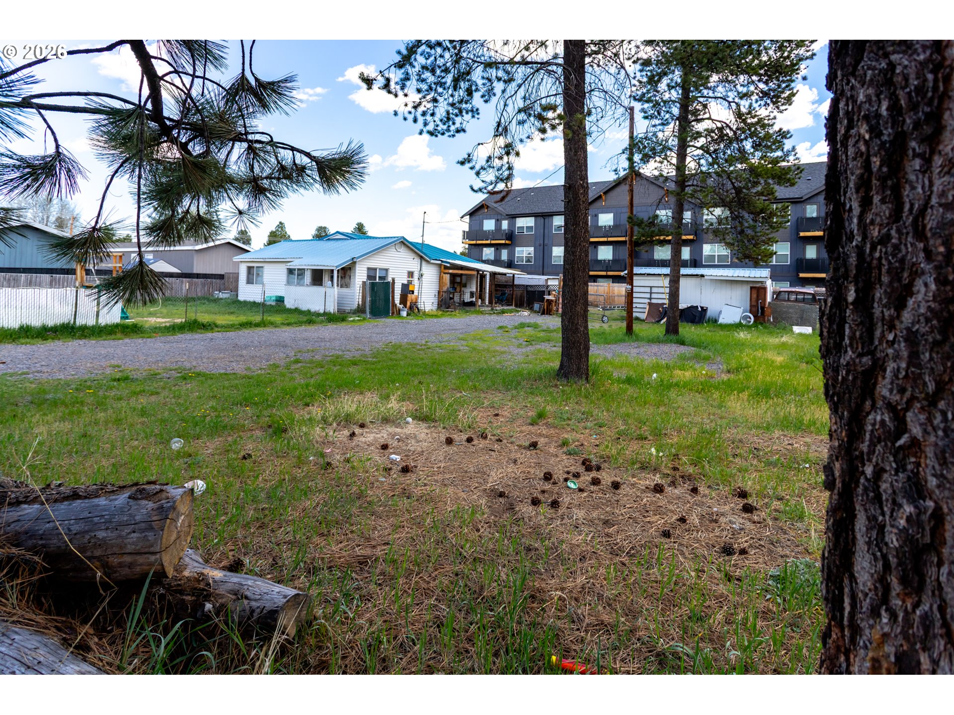 51380 Preble Way La Pine, OR 97739 - Photo 3 of 26 a view of a yard with a house in the background
