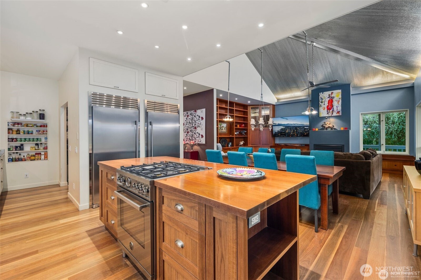 4712 Southwest Brace Point Drive Seattle, WA 98136 - Photo 11 of 40 a kitchen with stainless steel appliances granite countertop a stove and a refrigerator