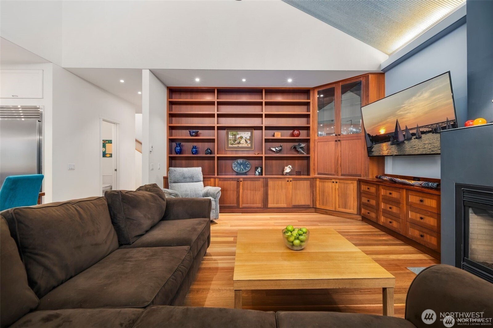 4712 Southwest Brace Point Drive Seattle, WA 98136 - Photo 15 of 40 a living room with furniture and a flat screen tv