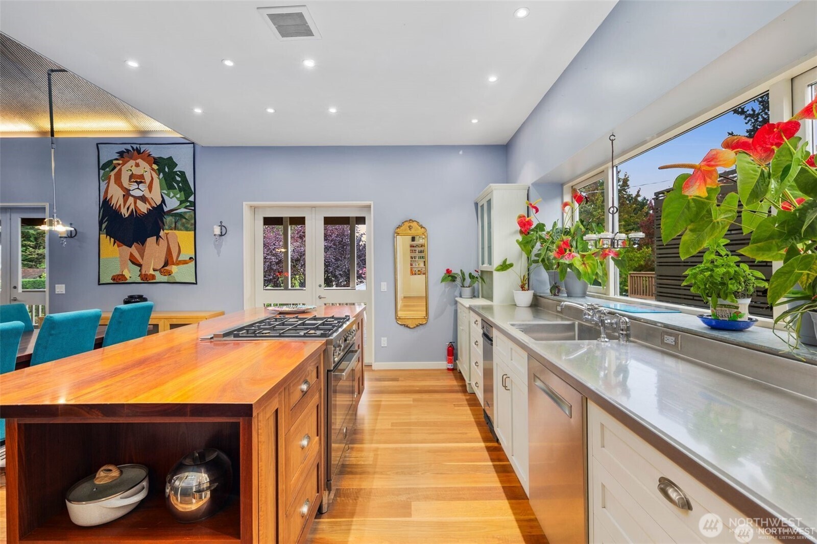 4712 Southwest Brace Point Drive Seattle, WA 98136 - Photo 19 of 40 a dining hall with stainless steel appliances granite countertop a sink and a stove