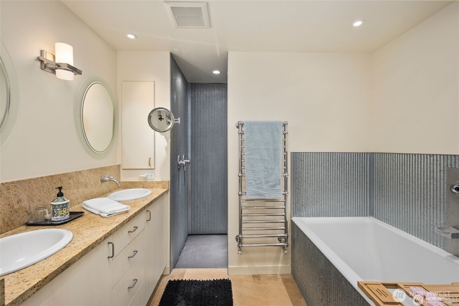4712 Southwest Brace Point Drive Seattle, WA 98136 - Photo 31 of 40 a bathroom with a granite countertop sink mirror and bathtub