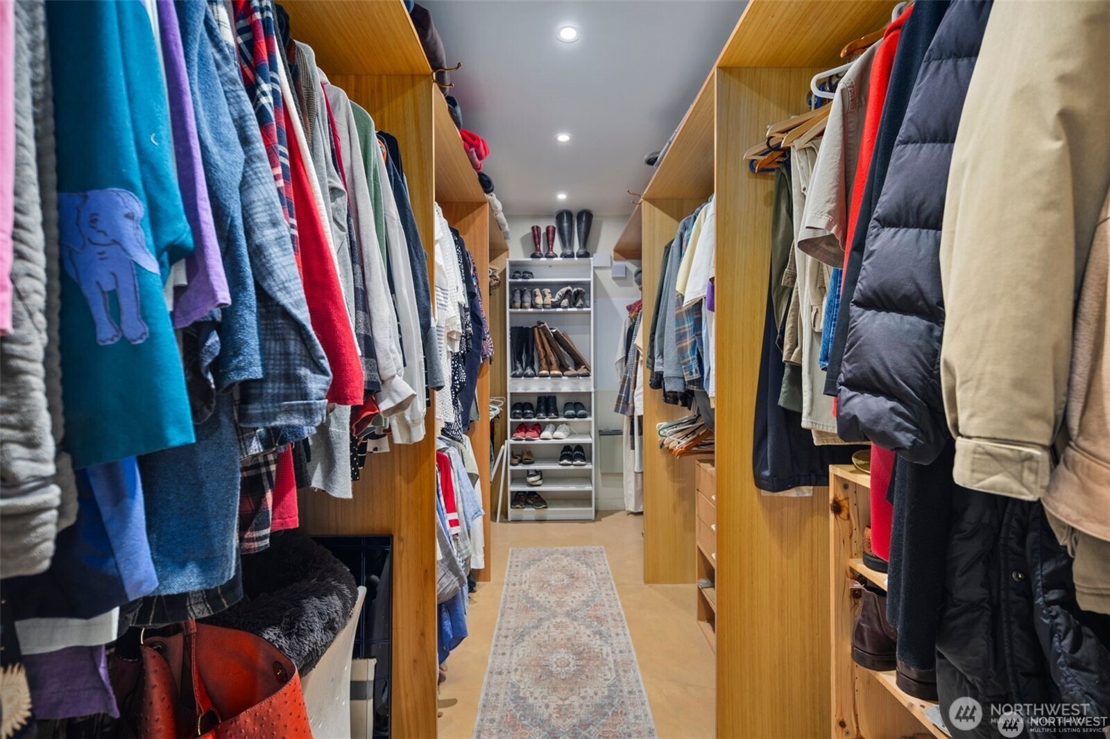 4712 Southwest Brace Point Drive Seattle, WA 98136 - Photo 32 of 40 a view of walk in closet with clothes and shoes