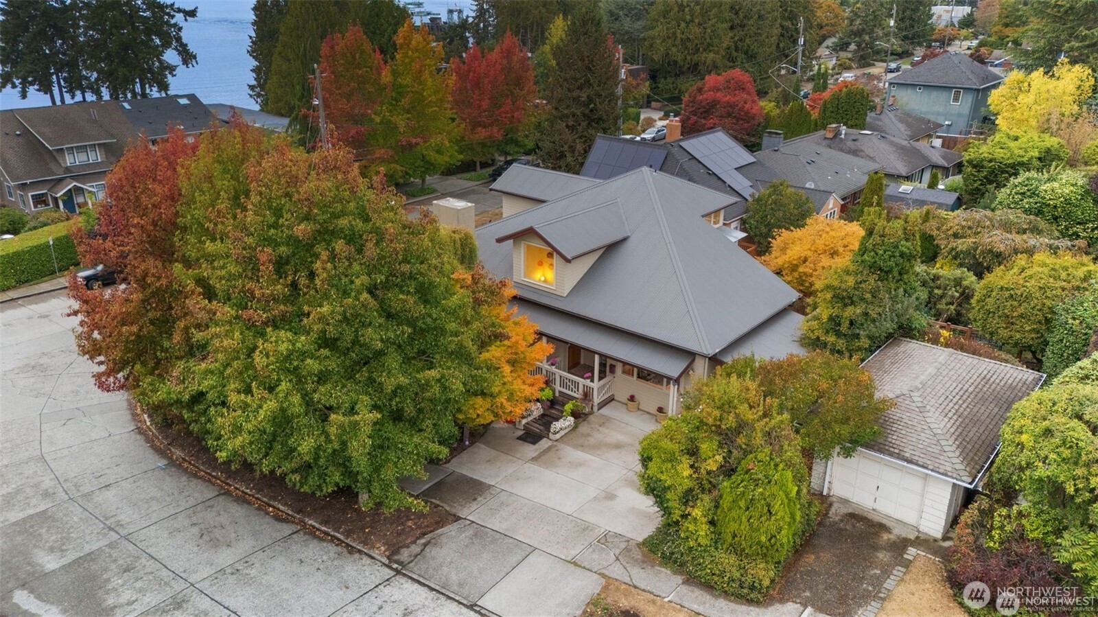 4712 Southwest Brace Point Drive Seattle, WA 98136 - Photo 40 of 40 an aerial view of multiple houses with yard