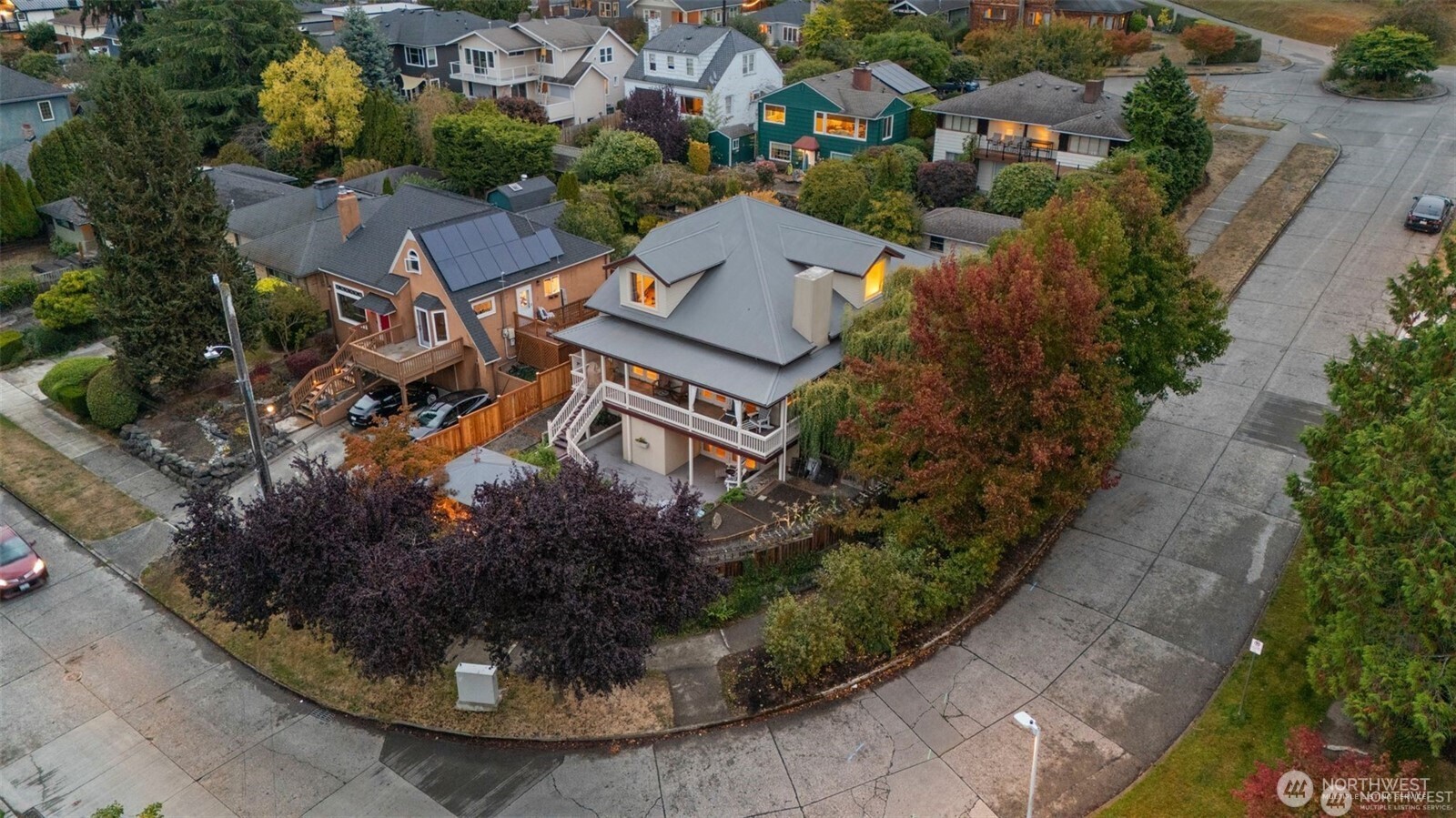 4712 Southwest Brace Point Drive Seattle, WA 98136 - Photo 4 of 40 an aerial view of residential houses with outdoor space and trees