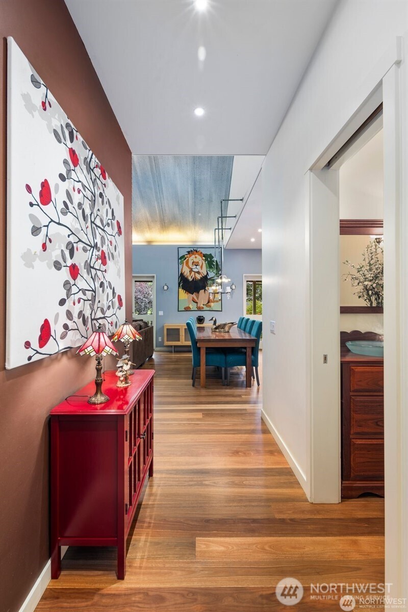 4712 Southwest Brace Point Drive Seattle, WA 98136 - Photo 10 of 40 a living room with furniture and a chandelier