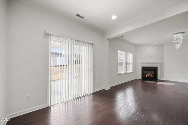 a kitchen with stainless steel appliances granite countertop a stove and a wooden floors