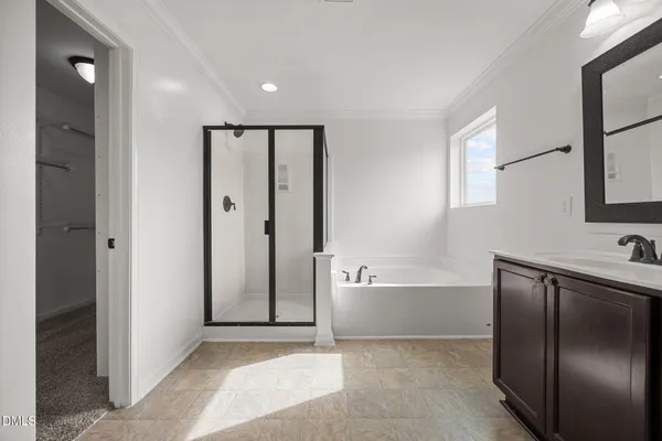 a bathroom with double sink and a mirror