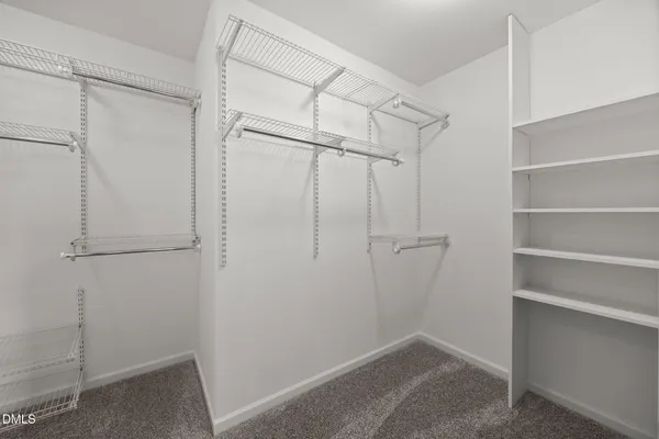 a spacious bathroom with a bathtub and a sink