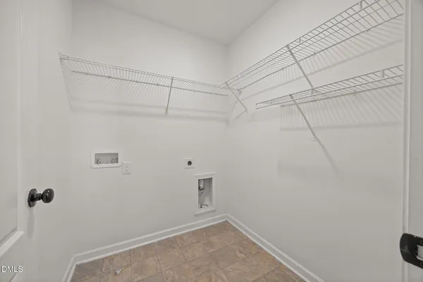 a view of empty room with windows