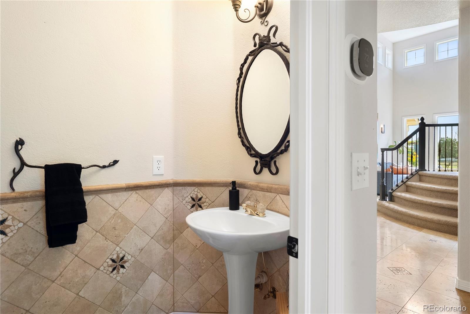 3822 Broadmoor Loop Broomfield, CO 80023 - Photo 26 of 50 a bathroom with a sink and a mirror