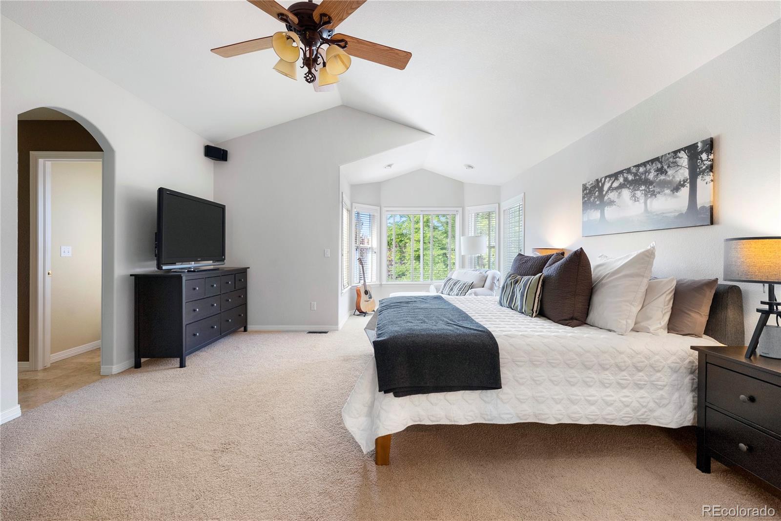 3822 Broadmoor Loop Broomfield, CO 80023 - Photo 28 of 50 a bedroom with a bed and a flat screen tv