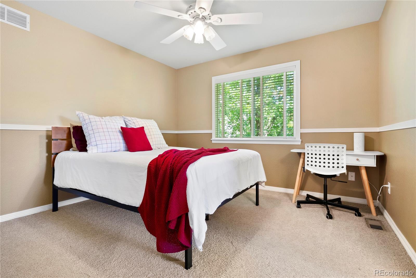 3822 Broadmoor Loop Broomfield, CO 80023 - Photo 32 of 50 a bedroom with a bed chair and a window