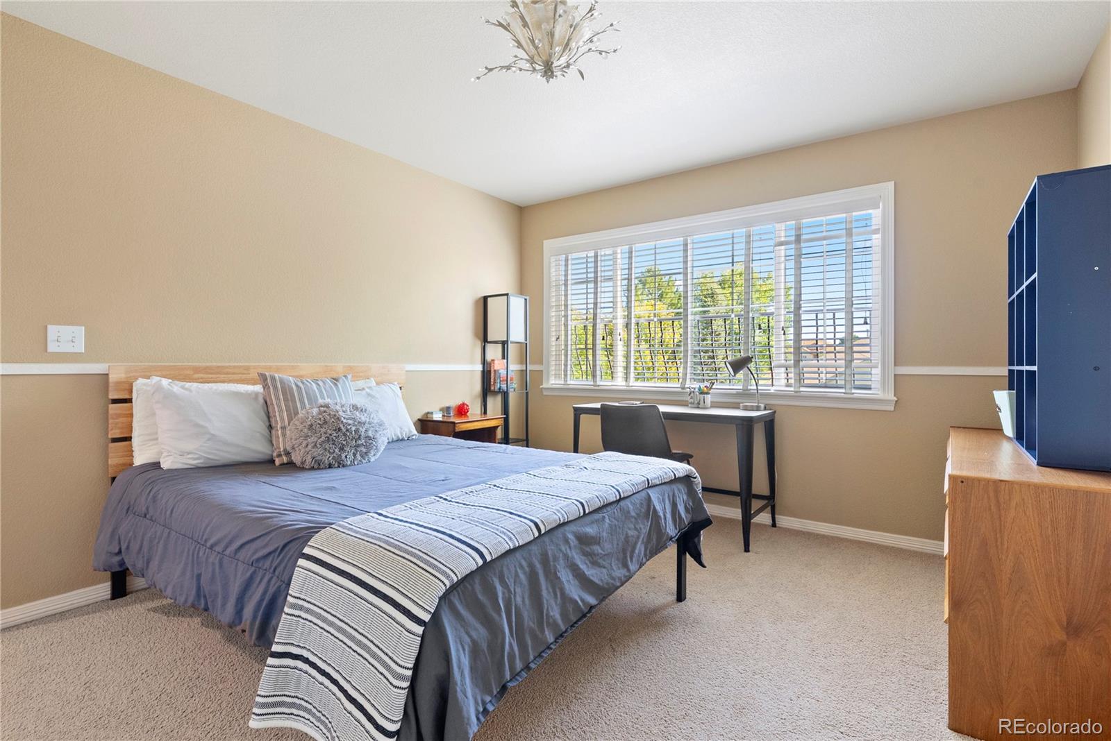 3822 Broadmoor Loop Broomfield, CO 80023 - Photo 33 of 50 a bedroom with a bed window and a desk
