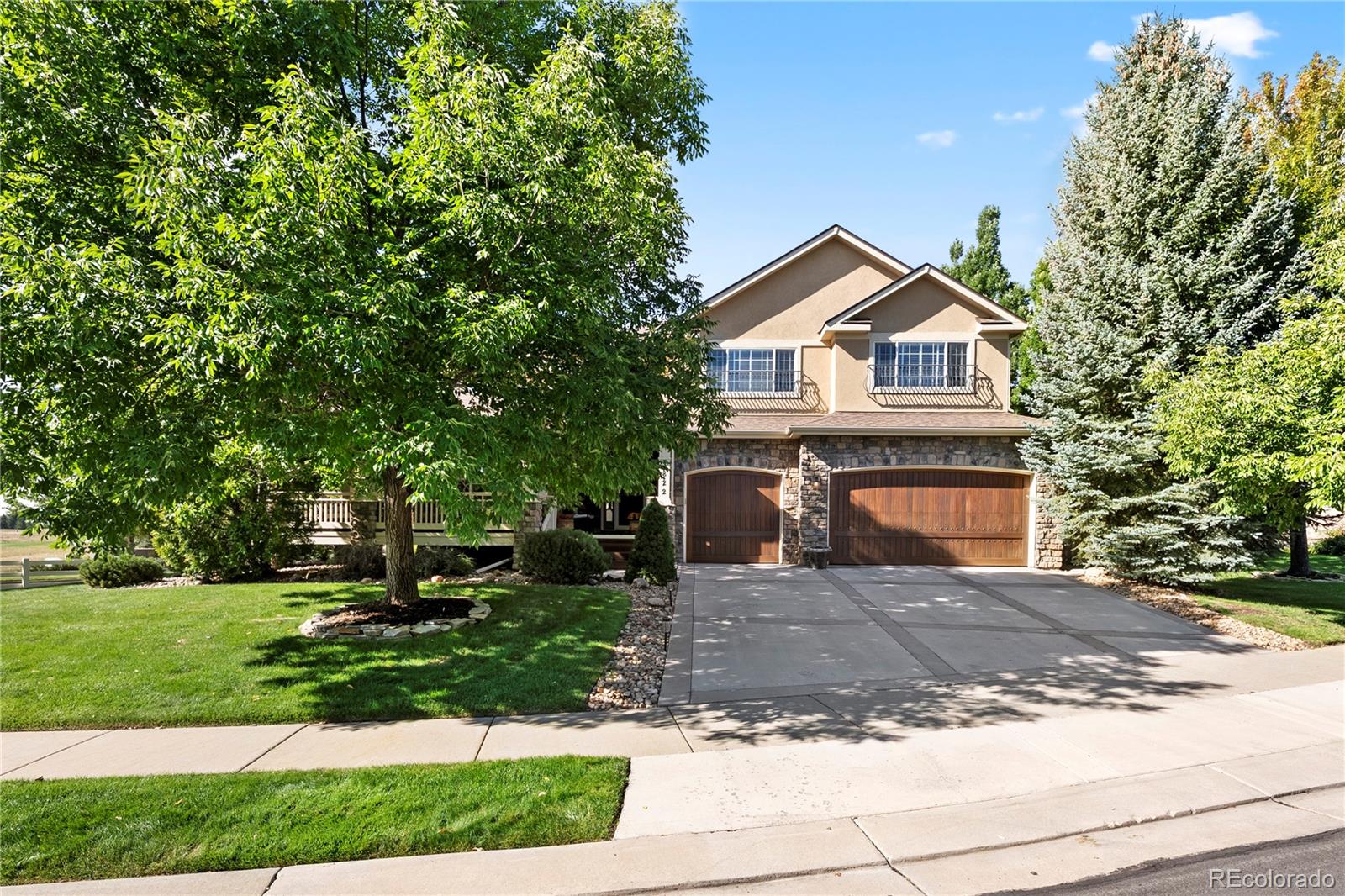 3822 Broadmoor Loop Broomfield, CO 80023 - Photo 4 of 50 a front view of a house with yard and green space