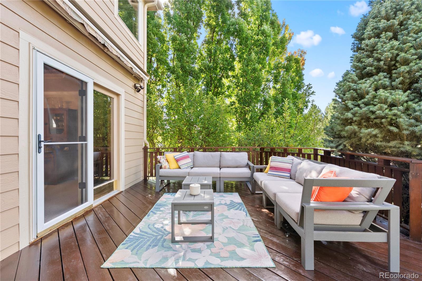 3822 Broadmoor Loop Broomfield, CO 80023 - Photo 44 of 50 a balcony with wooden floor and outdoor seating