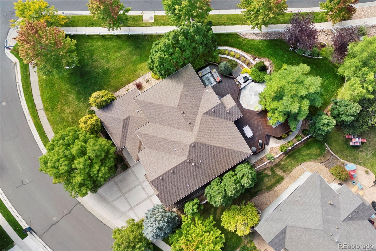 3822 Broadmoor Loop Broomfield, CO 80023 - Photo 48 of 50 an aerial view of a house with garden space and a patio