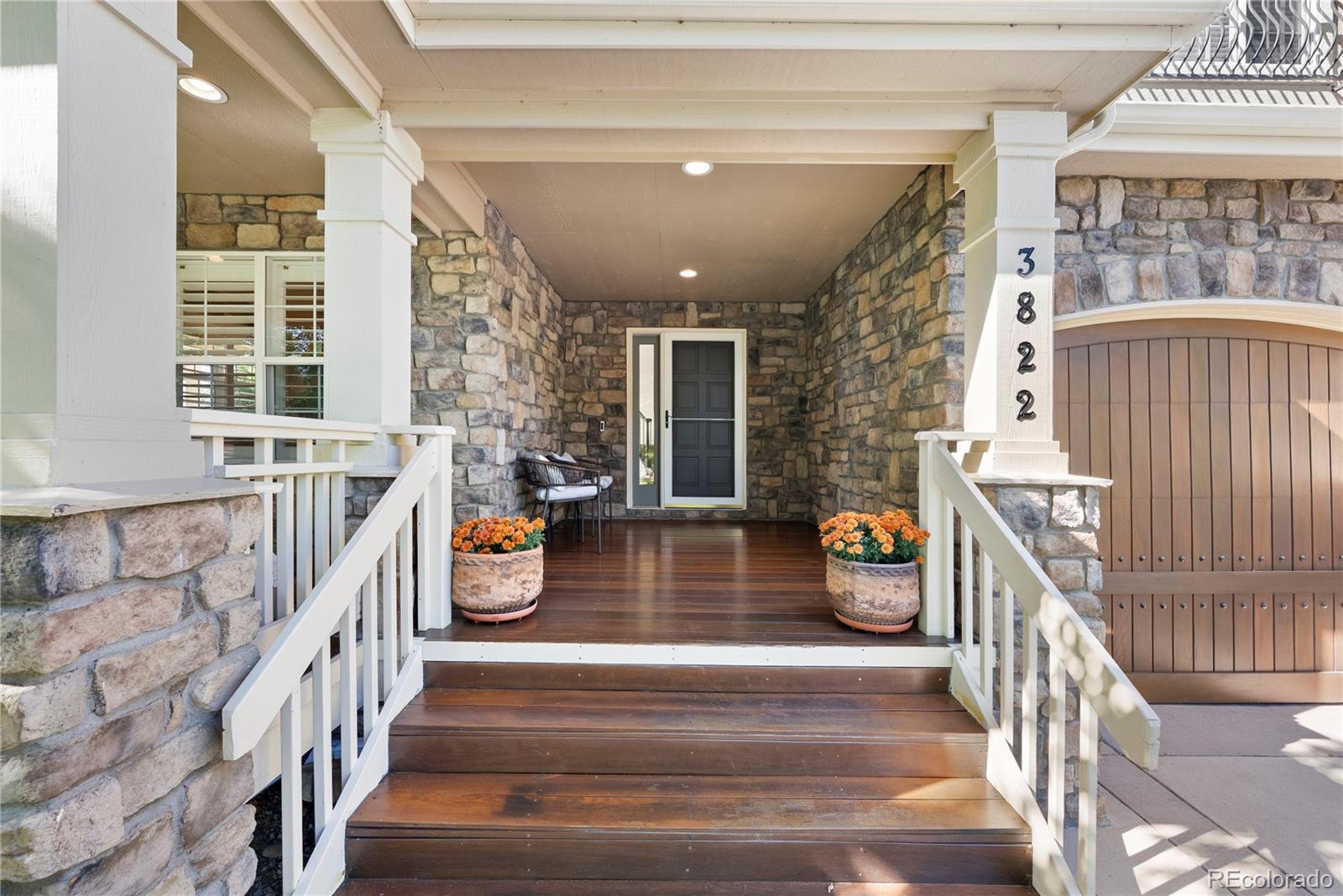 3822 Broadmoor Loop Broomfield, CO 80023 - Photo 7 of 50 a view of an entryway with wooden floor and a front door