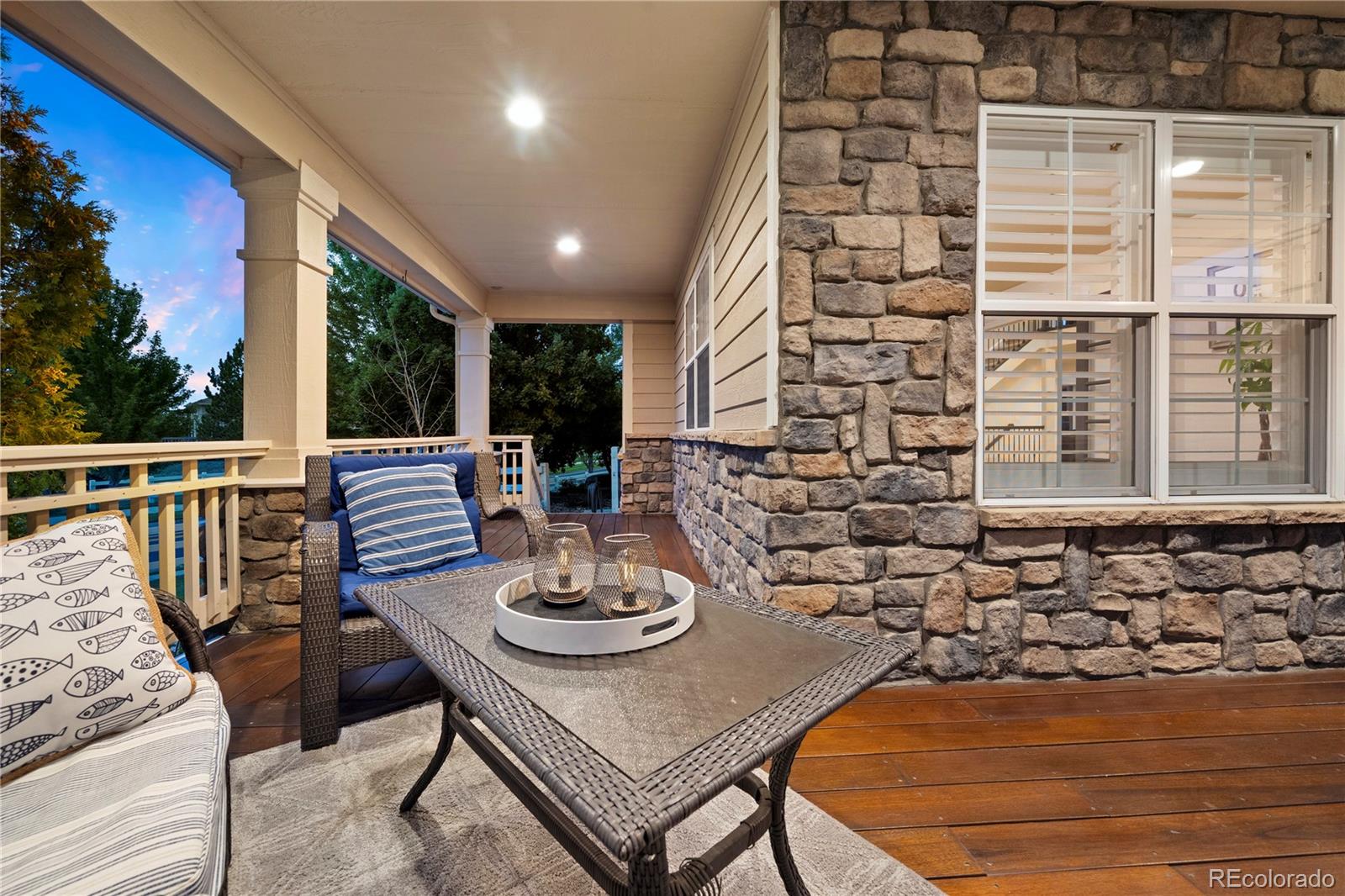 3822 Broadmoor Loop Broomfield, CO 80023 - Photo 8 of 50 a view of a patio with table and chairs and potted plants