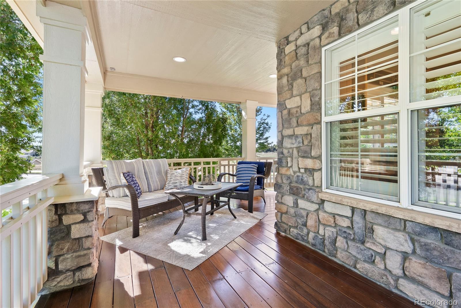 3822 Broadmoor Loop Broomfield, CO 80023 - Photo 9 of 50 a view of a dining room with furniture window and wooden floor