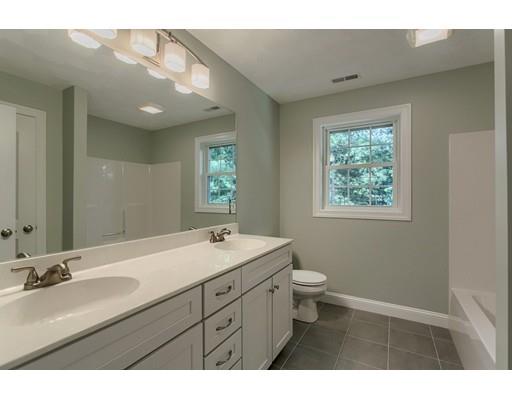 80 Whipple Road Billerica, MA 01821 - Photo 11 of 19 a bathroom with a double vanity sink toilet and a mirror