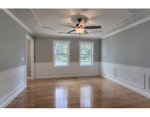 80 Whipple Road Billerica, MA 01821 - Photo 4 of 19 a view of empty room with wooden floor and fan