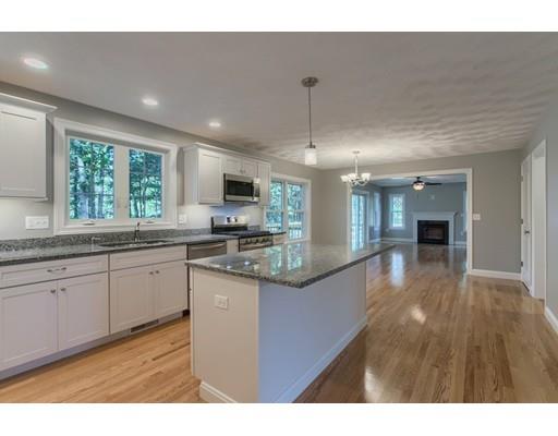 80 Whipple Road Billerica, MA 01821 - Photo 5 of 19 a large kitchen with kitchen island a large counter top space a sink stainless steel appliances and cabinets