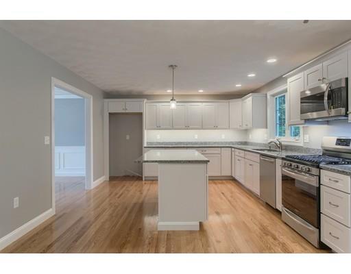 80 Whipple Road Billerica, MA 01821 - Photo 8 of 19 a kitchen with kitchen island a sink stainless steel appliances and cabinets