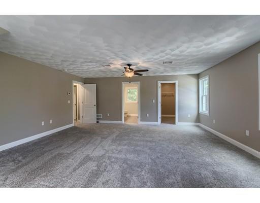 80 Whipple Road Billerica, MA 01821 - Photo 10 of 19 a view of a hallway with chandelier