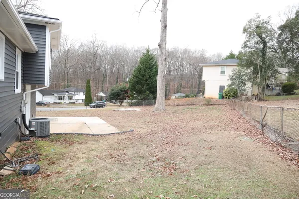 a view of a backyard of the house