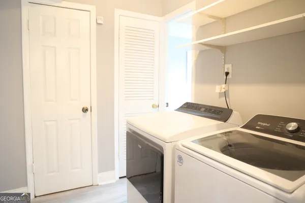 a utility room with dryer and washer