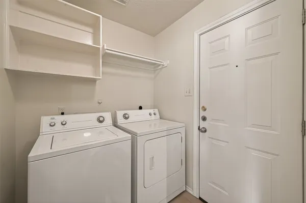a bathroom with a double vanity sink a mirror and a shower
