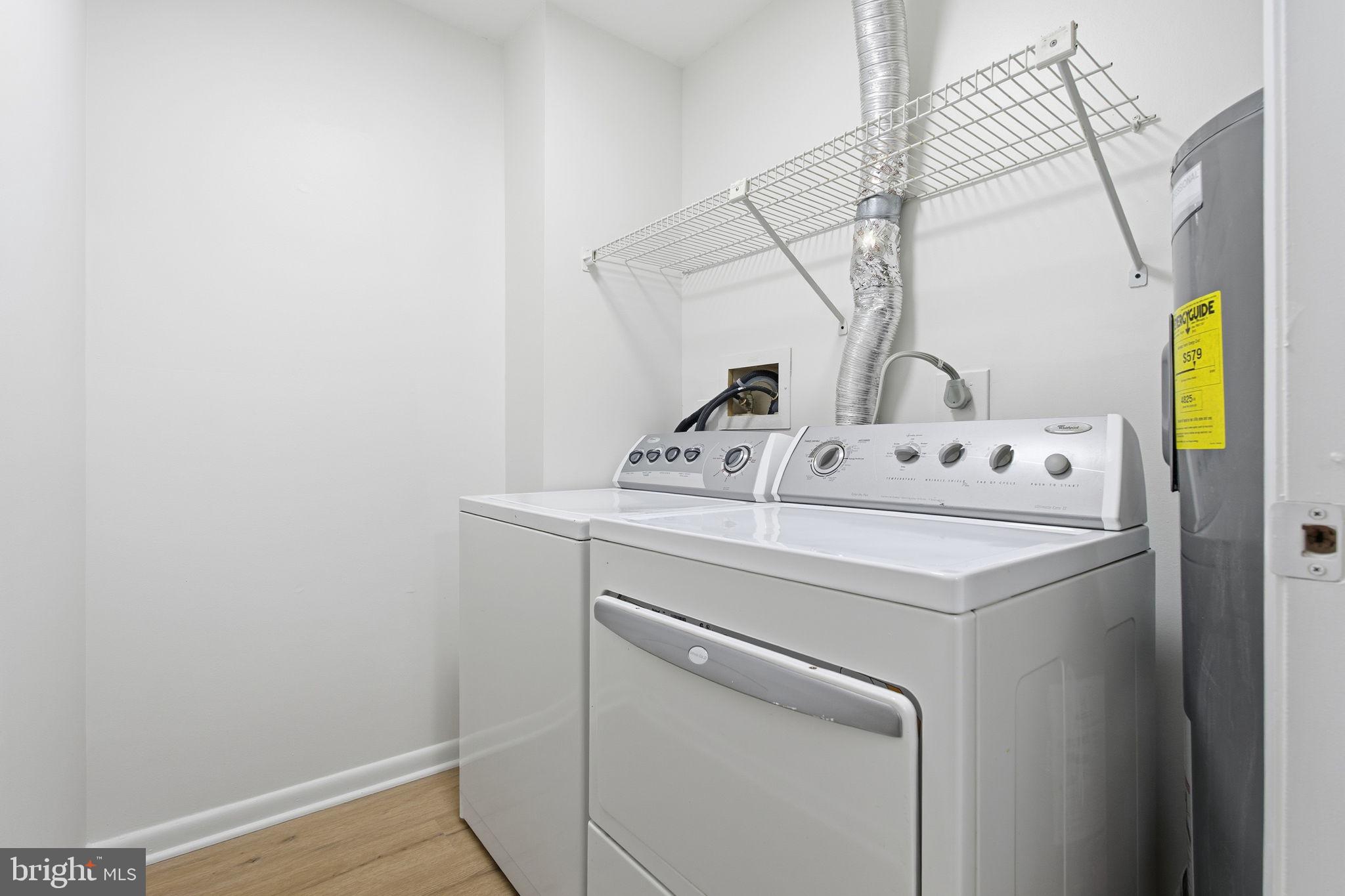 2201 Woodbox Lane, Unit 2201A Baltimore, MD 21209 - Photo 19 of 21 a utility room with dryer and washer