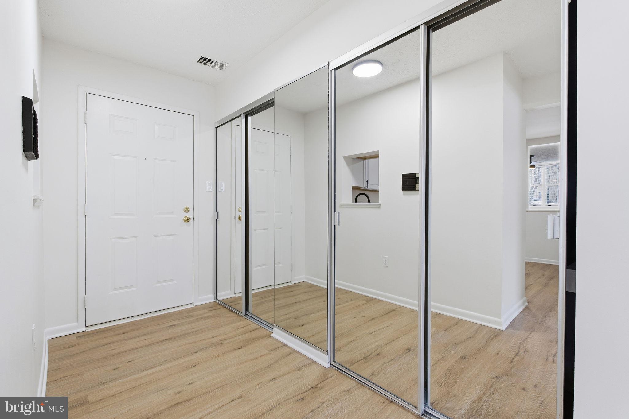 2201 Woodbox Lane, Unit 2201A Baltimore, MD 21209 - Photo 4 of 21 a bathroom with a shower and a glass door