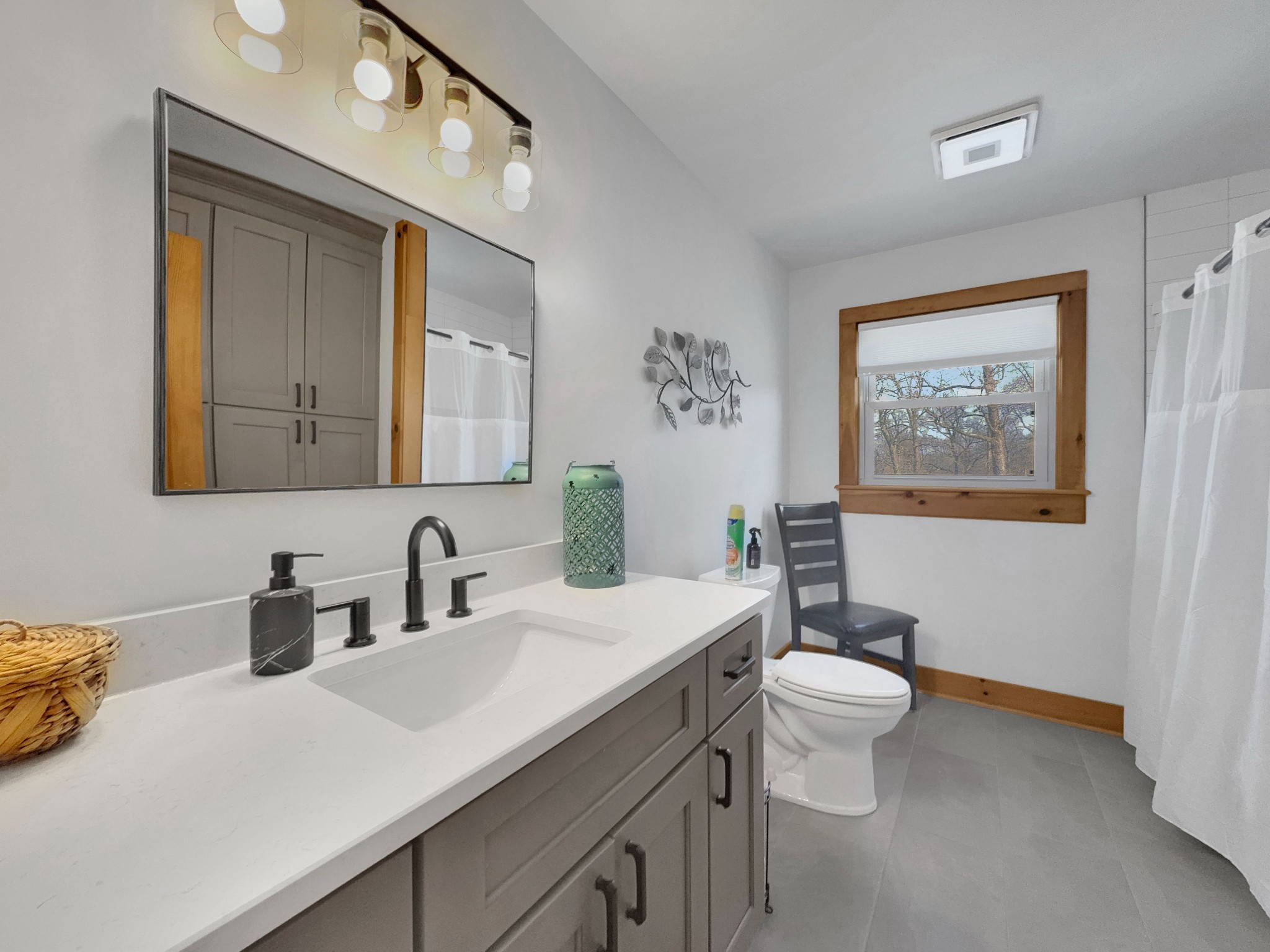 1706 Benders Ferry Road Mount Juliet, TN 37122 - Photo 31 of 79 a bathroom with a toilet a sink and mirror