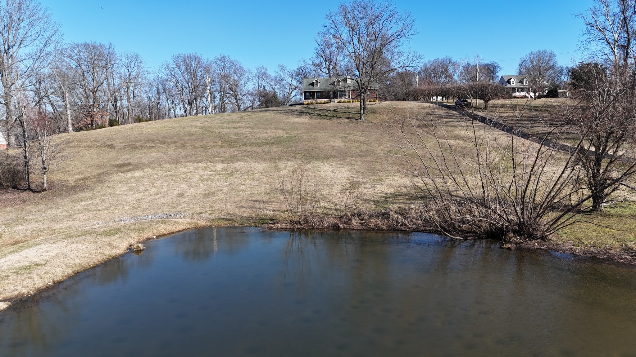 1706 Benders Ferry Road Mount Juliet, TN 37122 - Photo 54 of 79 a view of a lake with a yard